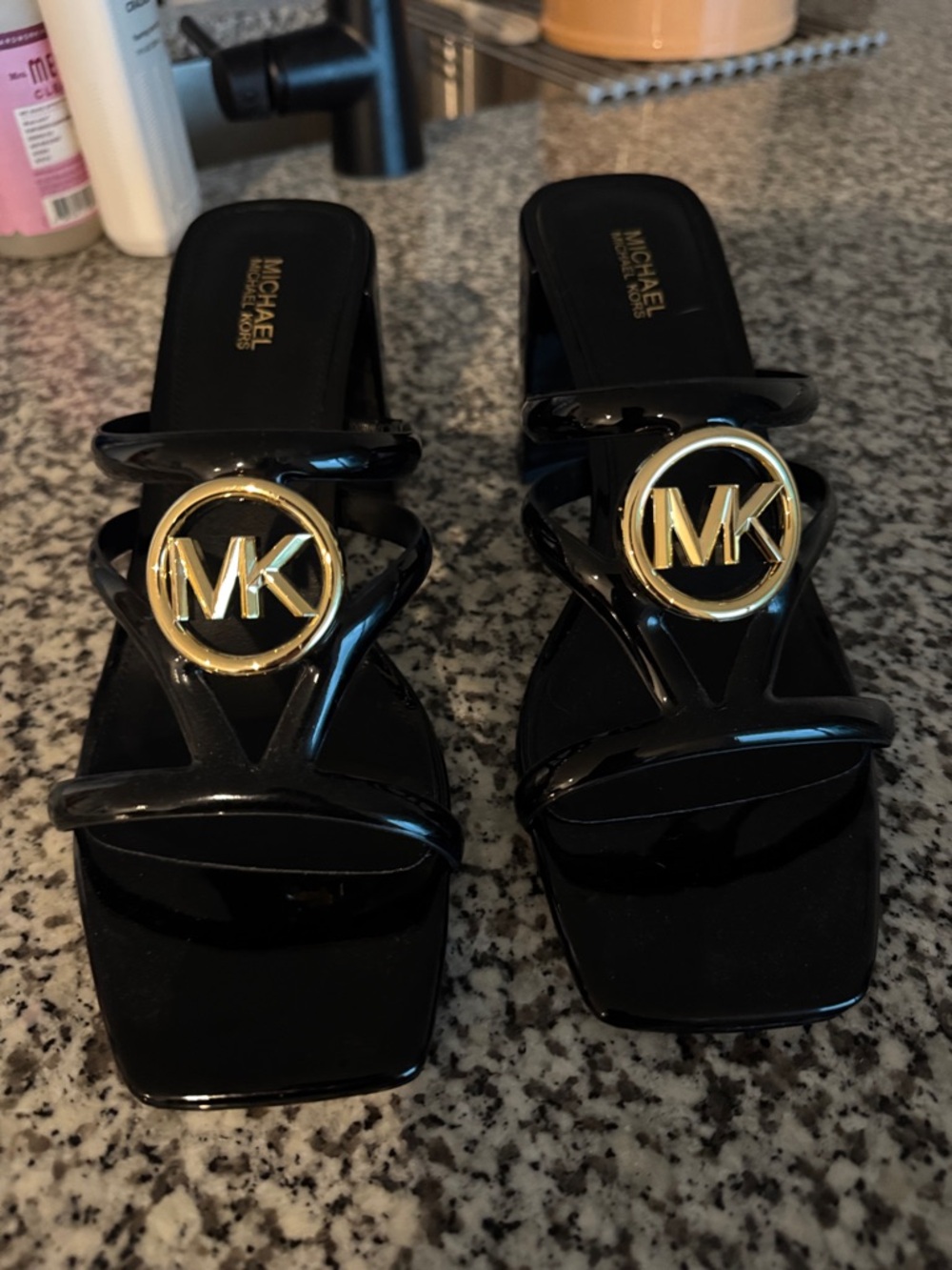 Michael Kors Black Patent Slide Mules with Gold MK Medallion